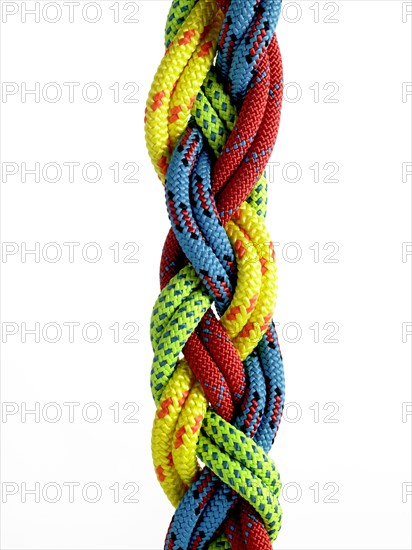 Colorful ropes braided together. Photo. David Arky