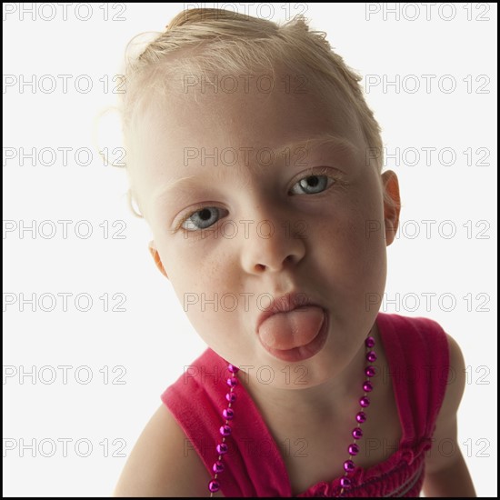 Toddler sticking her tongue out. Photo. Mike Kemp