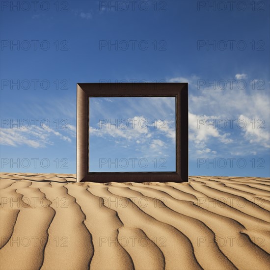 Picture frame on desert sand. Photo. Mike Kemp