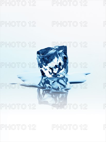 Melting ice cube. Photo. David Arky