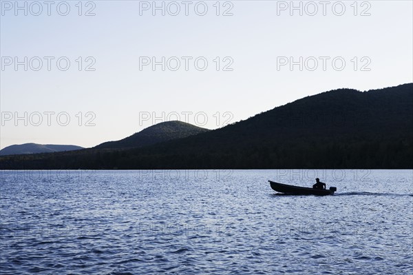 Motorboat on Lake Placid. Photo : Chris Hackett