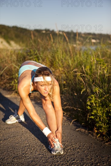 Runner stretching. Photo. Take A Pix Media