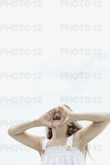 Young girl shouting. Photo. momentimages