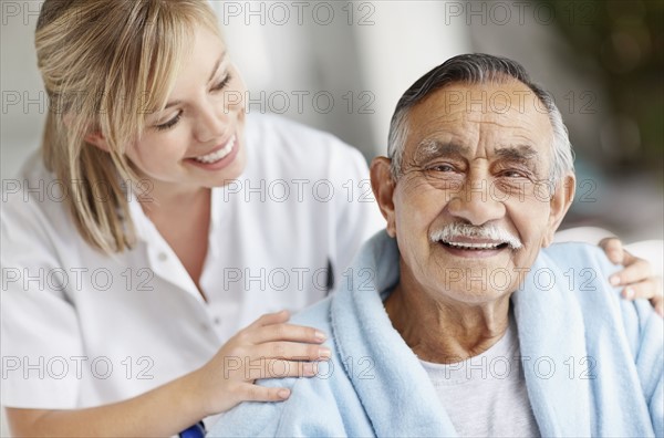 Nurse caring for senior patient. Photo. momentimages