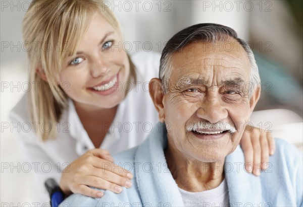 Nurse caring for senior patient. Photo. momentimages