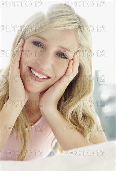 Pretty blond relaxing on bed. Photo : momentimages