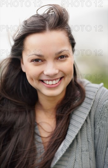 Smiling attractive brunette woman. Photo. momentimages