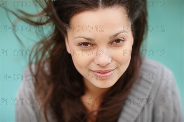 Smiling attractive brunette woman. Photo. momentimages