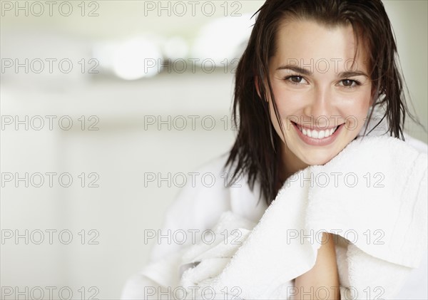 Woman wearing bathrobe. Photo. momentimages