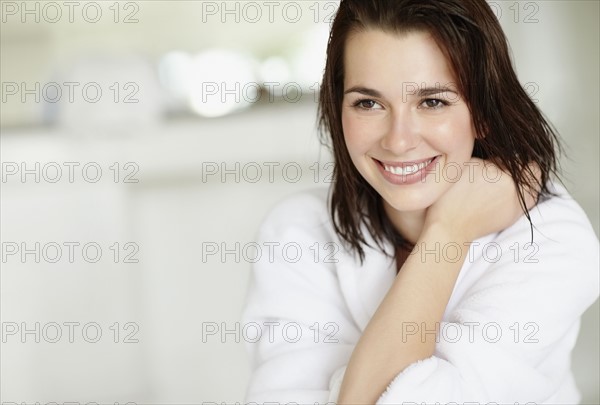 Woman wearing bathrobe. Photo : momentimages