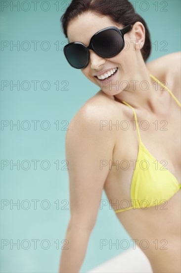 Attractive woman sunbathing. Photo. momentimages