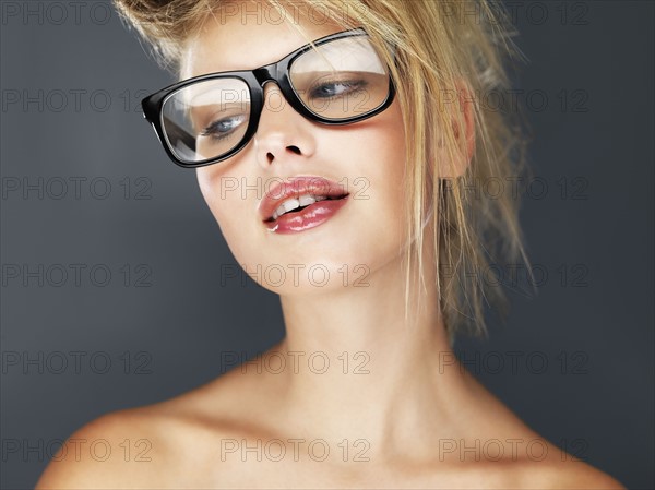 Sexy blond wearing glasses. Photo. momentimages