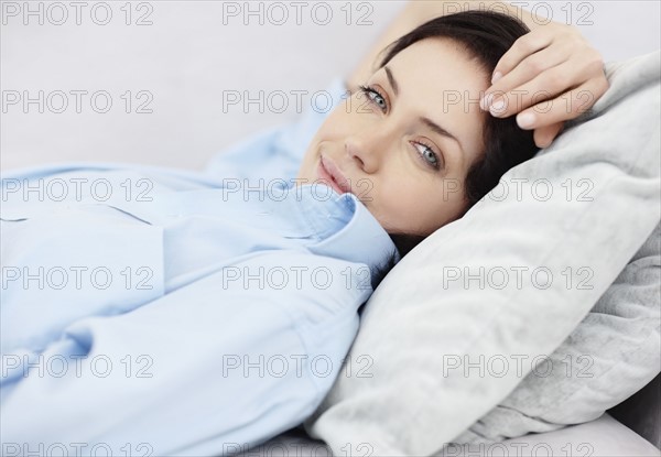 Brunette woman resting. Photo. momentimages