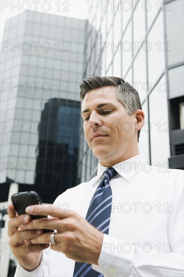 Businessman texting.