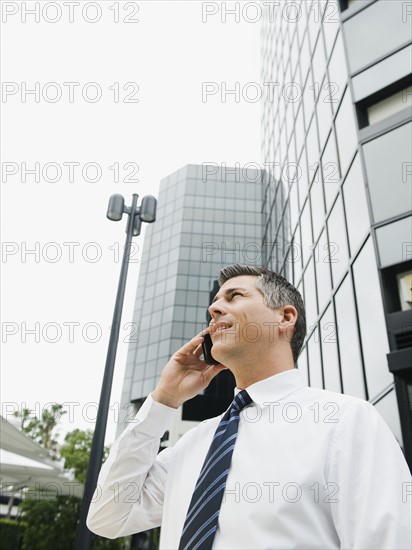 Businessman talking on cell phone.