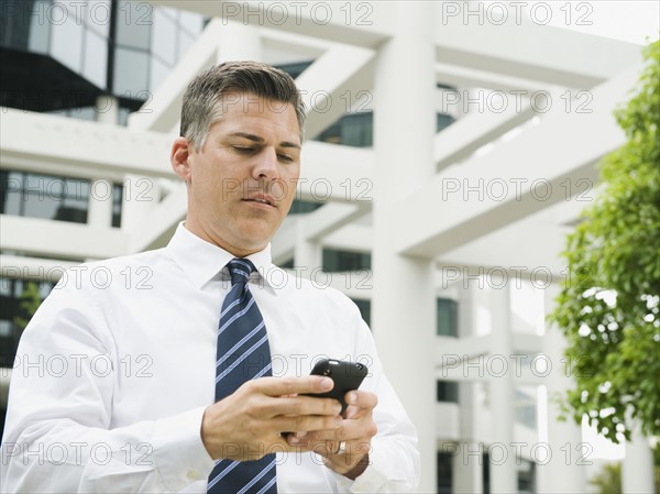 Businessman texting.