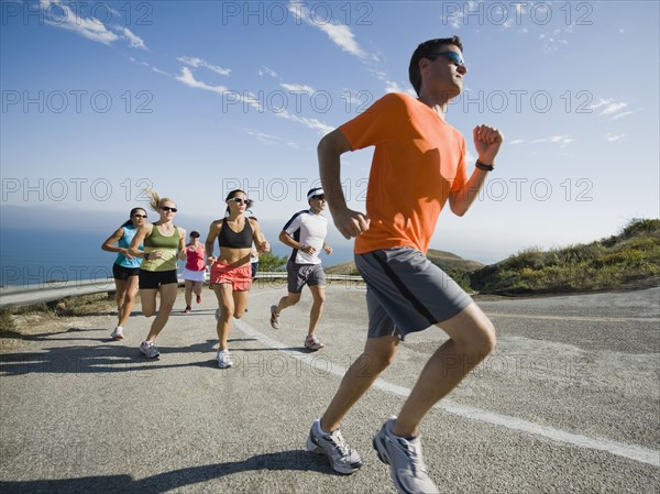 Runners on a road in Malibu.