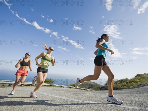 Runners on a road in Malibu.