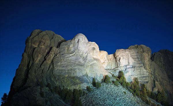 Mount Rushmore at night.