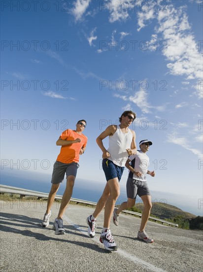 Runners on a road in Malibu.