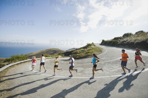 Runners on a road in Malibu.