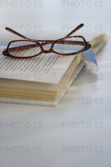 Reading glasses on book. Photo : Daniel Grill