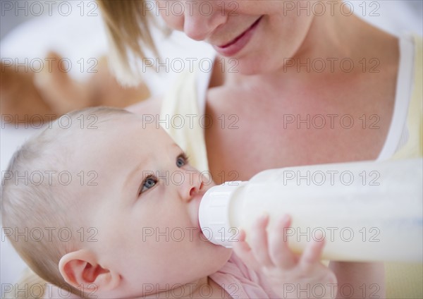 Mother feeding her baby. Photo : Jamie Grill