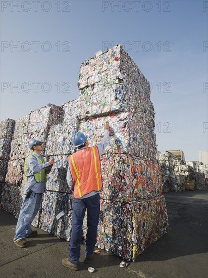 Workers at recycling plant.