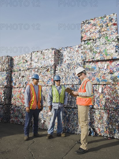 Workers at recycling plant.