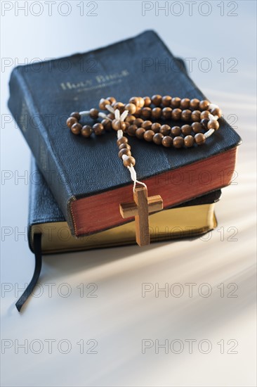 Rosary on bible.