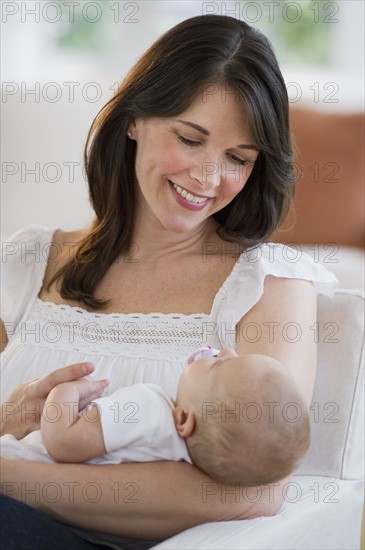 Mother holding her baby.