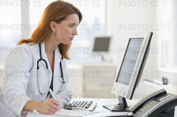 Doctor working at computer.