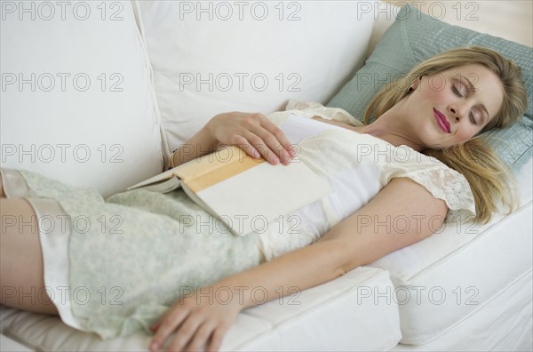 Woman resting on couch.