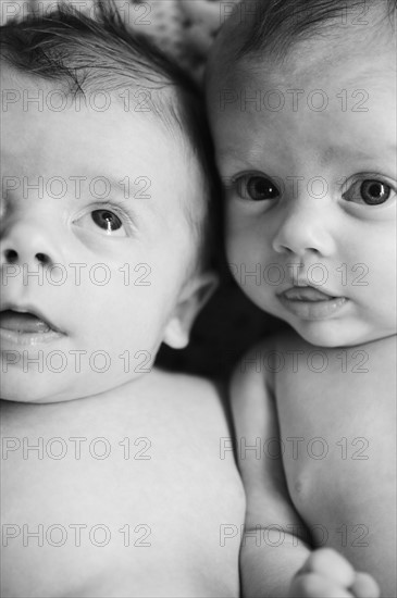 Two babies lying together. Photo. Jamie Grill