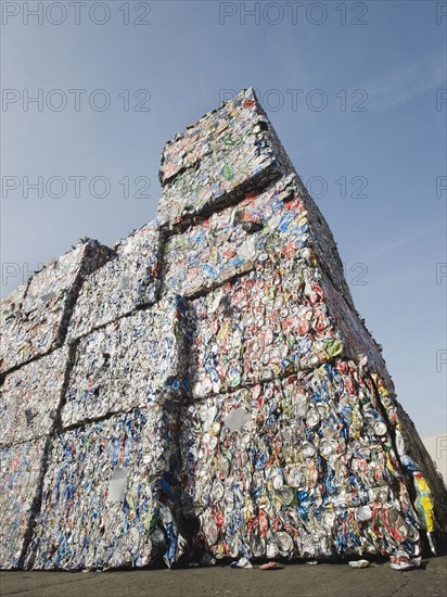 Stacks of crushed aluminum cans.