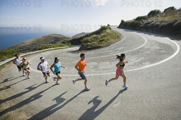 Runners on a road in Malibu.