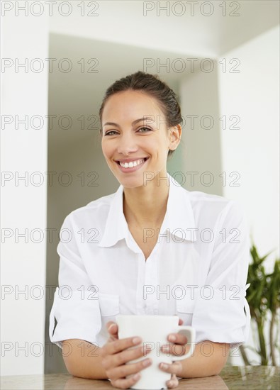 Woman drinking coffee. Photo. momentimages