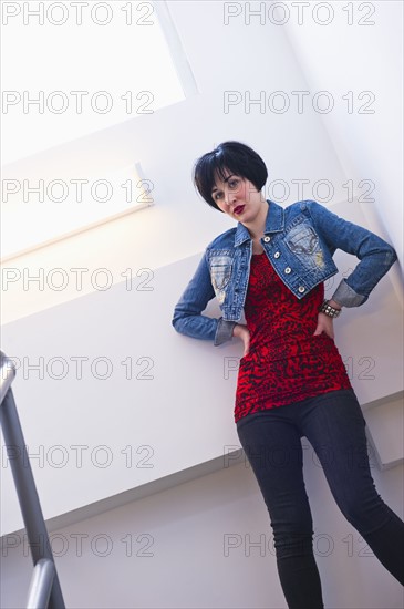 Woman standing in stairwell. Photo : Daniel Grill