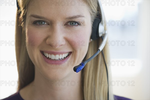 Woman wearing headset.