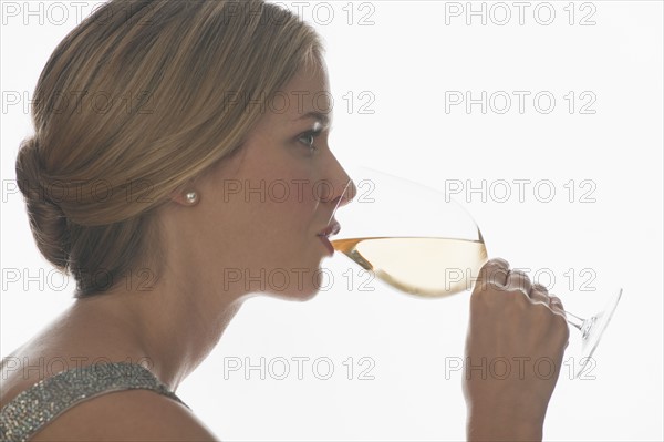 Sophisticated woman drinking wine.