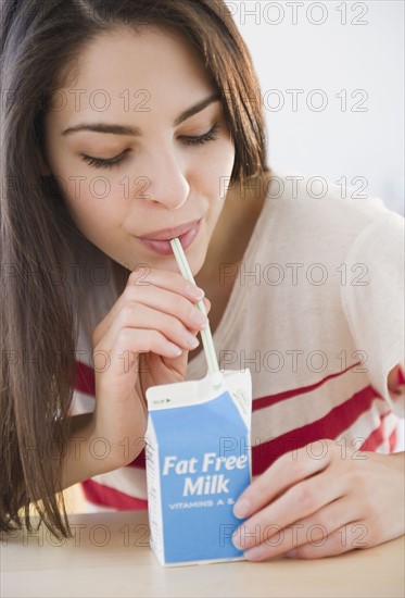 Woman drinking milk. Photo : Jamie Grill