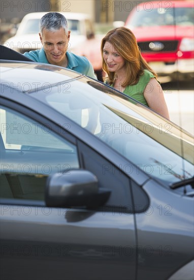 Couple shopping for a new car.
