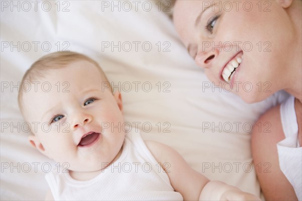 Mother and baby lying down together. Photo : Jamie Grill