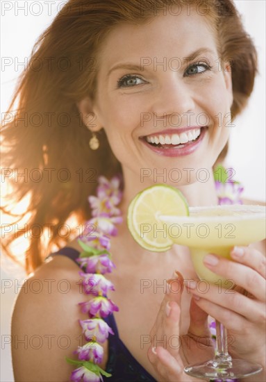 Woman drinking a frozen cocktail. Photo. Jamie Grill