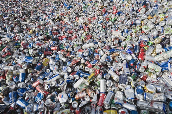 Pile of aluminum cans at recycling plant.