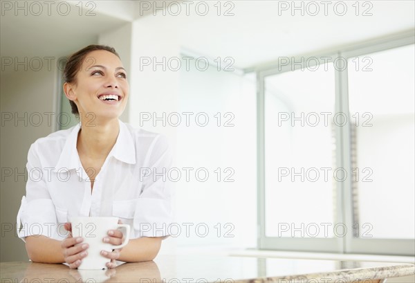 Woman drinking coffee. Photo. momentimages