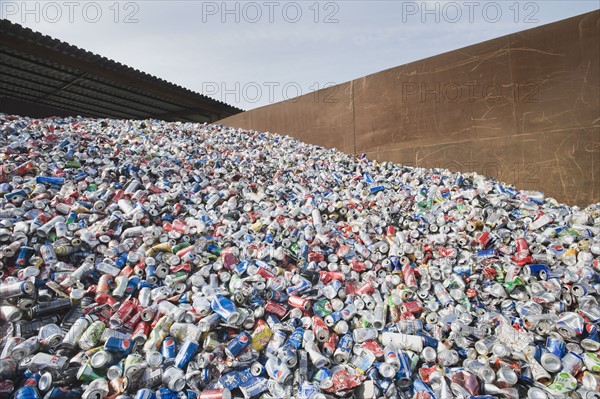 Pile of aluminum cans at recycling plant.