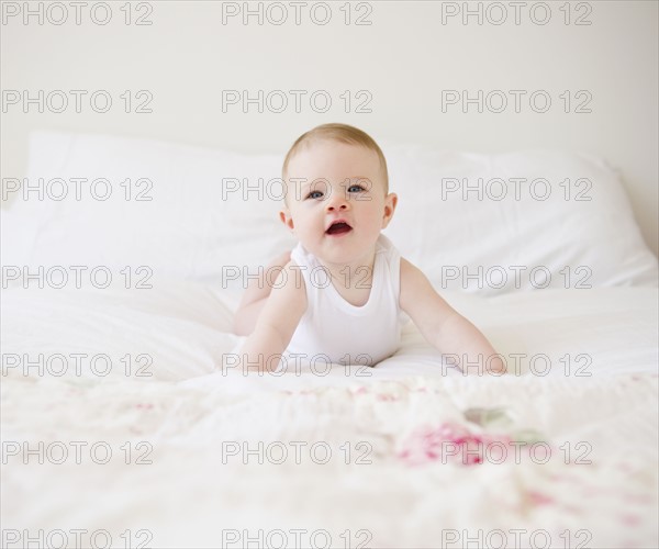 Baby on bed. Photo : Jamie Grill