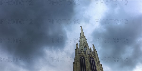 Dark clouds over steeple on Grace Church.