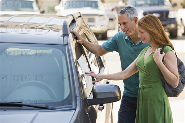 Couple shopping for a new car.